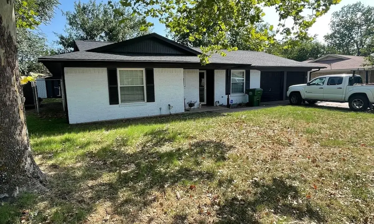 Professional roofing crew working on a residential roof in Santa Fe